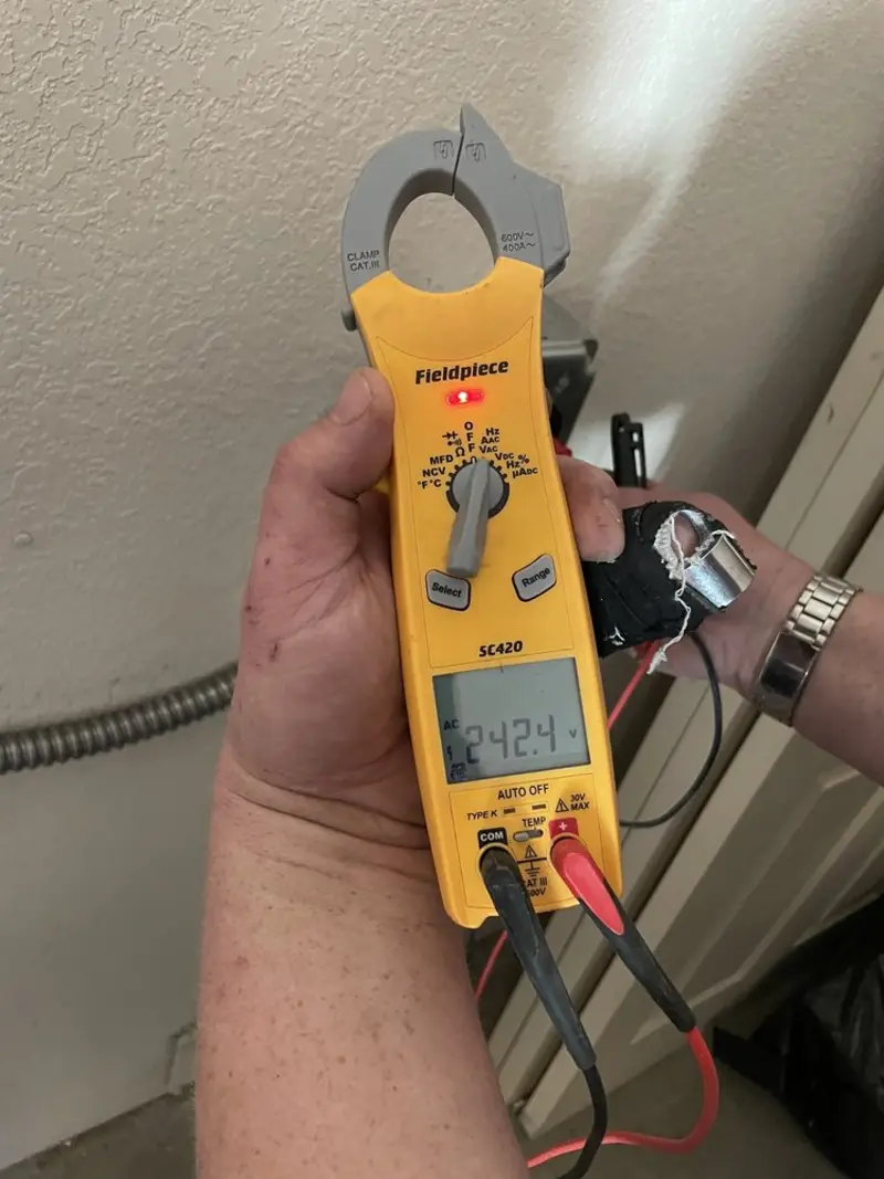 Voltage testing with clamp meter during Generator Installation in Acworth